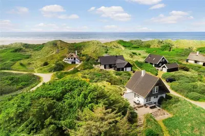 an aerial view of a house on a hill near the ocean at BL116-Saltum-Revlingevej-44 in Saltum
