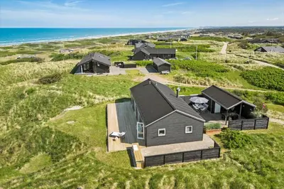 an aerial view of a house on the beach at LK553-Lokken-Rosavej-7 in Løkken
