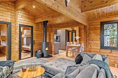 a living room with a couch and a stove at BL1224-Saltum-Vikingebanke-7 in Saltum