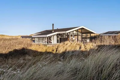 a house sitting on top of a beach at BL1265-Saltum-Faaborgvej-7 in Saltum