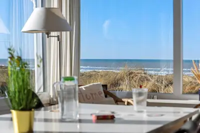 a room with a table with a view of the ocean at LK2130-Lokken-Lottesvej-23 in Løkken