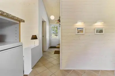 a hallway of a home with a white wall at BL547-Blokhus-Skraavejen-8 in Blokhus