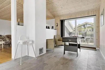 a living room with a desk and a dining room at BL1333-Pandrup-Hunetorp-Klitvej-109 in Pandrup