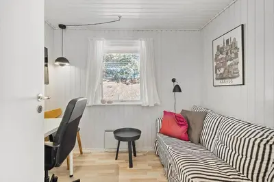 a living room with a couch and a table at BL1131-Saltum-Daadyrvej-11 in Saltum
