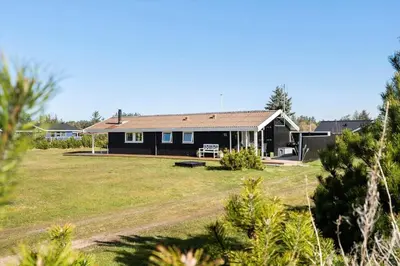 a house with a large yard in front of it at LK2141-Lokken-Kristavej-15 in Løkken