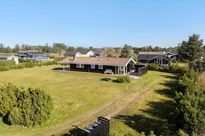 an aerial view of a house with a yard at LK2141-Lokken-Kristavej-15 in Løkken