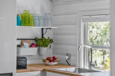 a kitchen counter with a sink and a window at BL1363-Blokhus-Fiskene-7 in Blokhus