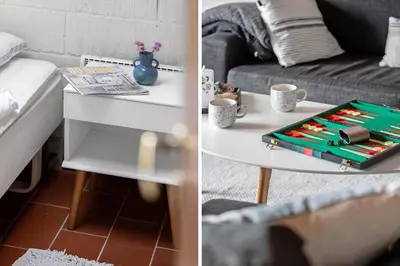 a living room with a table and a couch at BL1309-Blokhus-Quintusvej-22 in Blokhus