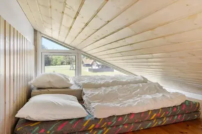 three beds in a room with a wooden ceiling at BL512-Saltum-Trehoje-2 in Saltum