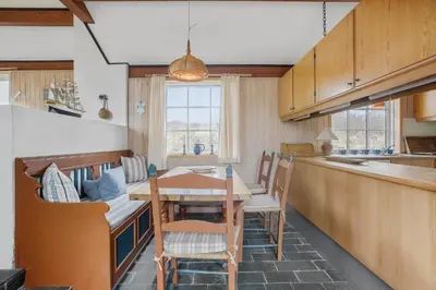 a kitchen and dining room with a table and chairs at BL1241-Saltum-Bondagervej-2 in Saltum