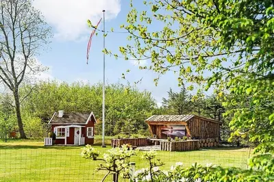 a small cabin in the middle of a yard at BL1092-Saltum-Doggerbanke-2 in Saltum