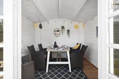 a porch with a table and chairs on a patio at BL209-Saltum-Silkeborgvej-6 in Saltum