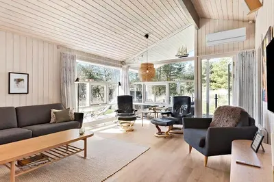a living room with a couch and a table at BL209-Saltum-Silkeborgvej-6 in Saltum