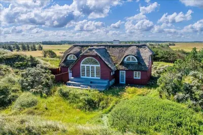 an old house in the middle of a field at BL672-Pandrup-Strandfogdensvej-56 in Pandrup