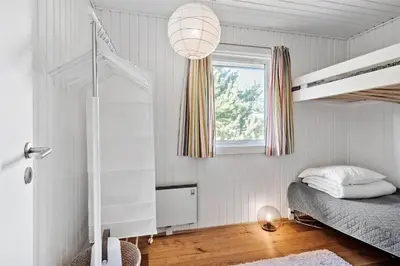 a bedroom with a bunk bed and a window at BL1716-Saltum-Viborgvej-2 in Saltum