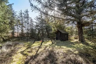 a swing set in the middle of a forest at BL1716-Saltum-Viborgvej-2 in Saltum