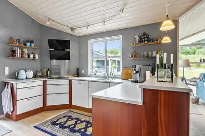 a kitchen with a sink and a counter top at BL1577-Blokhus-Lars-Liensvej-27 in Blokhus