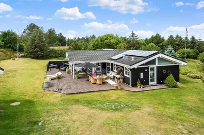 an aerial view of a house with a deck at BL1577-Blokhus-Lars-Liensvej-27 in Blokhus