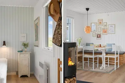 a living room and a dining room with a fireplace at BL1020-Pandrup-Hunetorp-Klitvej-257 in Pandrup