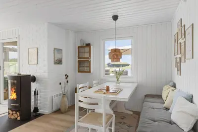 a living room with a table and a couch at BL1020-Pandrup-Hunetorp-Klitvej-257 in Pandrup