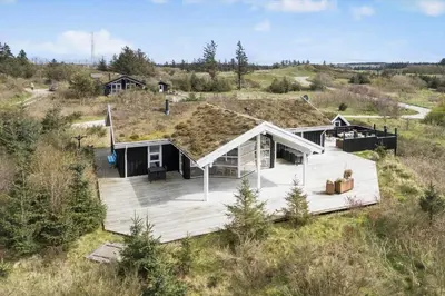 an overhead view of a house with a wooden deck at BL189-Saltum-Bondagervej-71 in Saltum