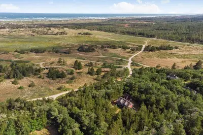 an aerial view of a field with trees and a road at BL1570-Pandrup-Flaskehalsen-13-A in Pandrup