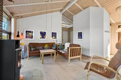 a living room with a couch and a table at BL852-Saltum-Revlingevej-14 in Saltum