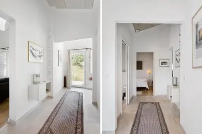 a white hallway with a living room and a bedroom at BL1231-Pandrup-Lunen-54 in Pandrup