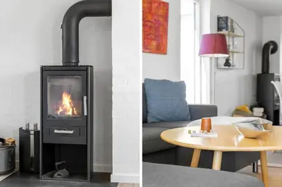 two pictures of a living room with a fireplace at BL509-Blokhus-Jens-Baerentsvej-7 in Blokhus