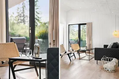 a living room with a table and chairs at BL1485-Blokhus-Jaegervaenget-2-A in Blokhus