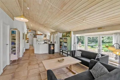 a living room with a couch and a table at BL450-Saltum-Graabakken-8 in Saltum
