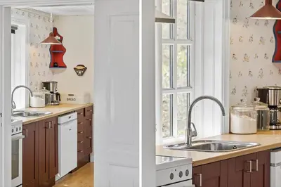 a kitchen with two sinks and a window at BL1459-pandrup-Gl-Jacobsvej-24 in Pandrup