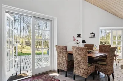 a dining room with a table and chairs at BL1588-Pandrup-Lunen-88 in Pandrup