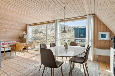 a dining room with a table and chairs at BL1738-Pandrup-Narhvalen-11 in Pandrup