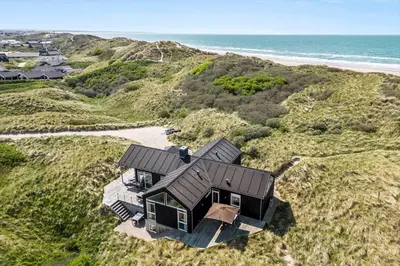 an aerial view of a house on a beach at BL1468-Blokhus-Moreavej-59-B in Blokhus