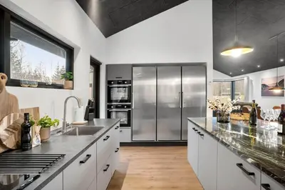 a large kitchen with a stainless steel refrigerator at BL1479-Saltum-Solmarken-1 in Saltum