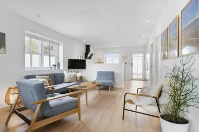 a living room with a couch and chairs at BL1708-Blokhus-Klitgaardsvej-3-D in Blokhus