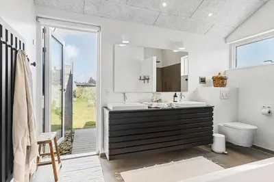 a bathroom with a sink and a toilet at BL1712-Blokhus-Vestvej-6 in Blokhus