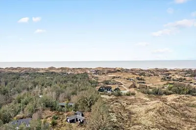 an aerial view of a town with the ocean in the background at BL1327-Blokhus-Braendevinsstien-5 in Blokhus