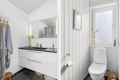 a white bathroom with a sink and a toilet at BL1428-Saltum-Karen-Mariesvej-31-D in Saltum