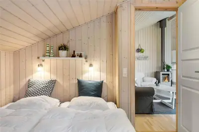 a bedroom with two beds and a living room at BL757-Saltum-Tolhoj-12 in Saltum