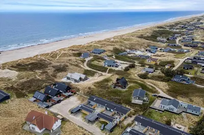 an aerial view of a beach with houses and the ocean at BL1359-Blokhus-Bellevueparken-24 in Blokhus