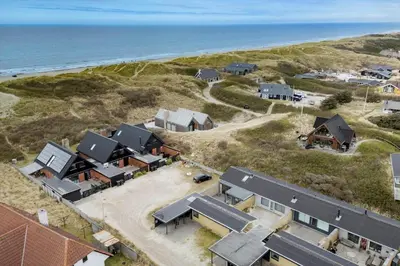 an aerial view of a house on the beach at BL1359-Blokhus-Bellevueparken-24 in Blokhus