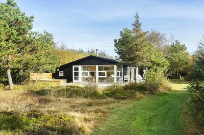 a black house in the middle of a field at BL1589-Saltum-Bondagervej-52 in Saltum