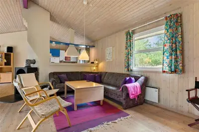 a living room with a couch and a table at BL1786-Saltum-Ornebjergvej-22 in Saltum