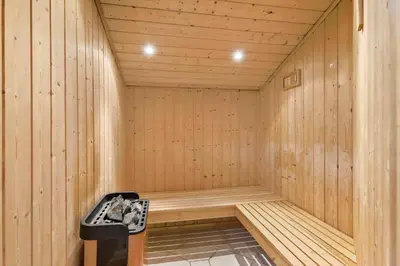 a wooden sauna with a trash can in it at BL295-Saltum-Graabakken-2 in Saltum