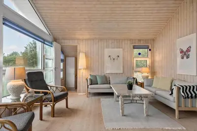 a living room with a couch and a table at BL295-Saltum-Graabakken-2 in Saltum