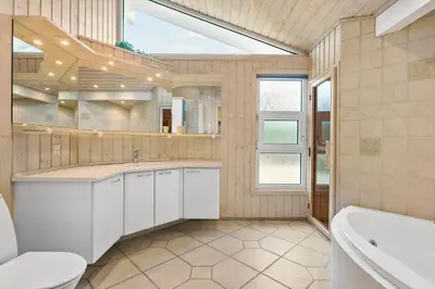 a bathroom with a toilet and a sink and a tub at BL295-Saltum-Graabakken-2 in Saltum