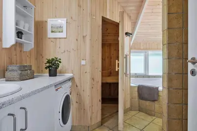 a bathroom with a washer and dryer at BL279-Pandrup-Rodhusparken-71 in Pandrup