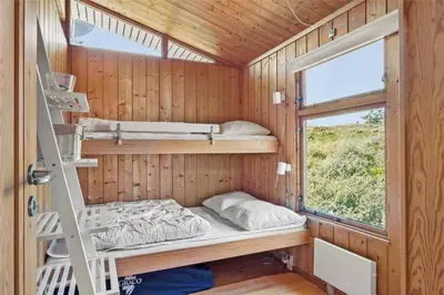 a small room with bunk beds and a window at BL199-Saltum-Daadyrvej-22 in Saltum
